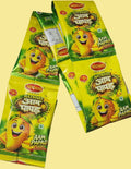 Desipan Neena's Natkhat Aam Papad fruit leather snacks in yellow packaging with a cartoon mango.