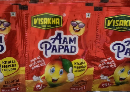 Desipan Visakha Aam Papad fruit snack packaging with a cartoon mango giving a thumbs up.