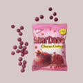 Desipan Anardana Churan Goliyan pomegranate candies, small round red treats coated in powder, with a pomegranate image on the pink packaging.