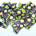 Desipan Black Mango Almond candies, individually wrapped, featuring a sweet and tangy exotic mango flavor with a hint of almond.