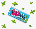 Desipan Wrigley's Boomer Fresh Mint bubble gum pack on a white background with decorative green mint leaves
