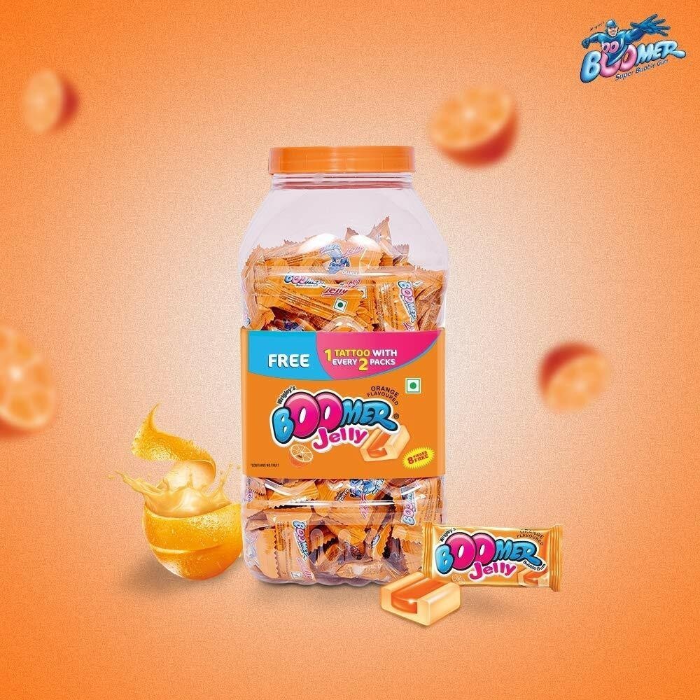 Desipan Boomer Jelly Orange Flavoured candies in a jar, individually wrapped with a free tattoo offer.