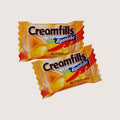 Desipan Creamfills Alpenliebe Butter Toffee candies with creamy center, individually wrapped in golden foil.
