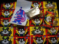 Desipan cartoon bear candy bars in red and yellow packaging with playful designs.