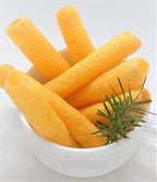 Desipan golden-orange cheese-flavored corn puff snack sticks in a white bowl