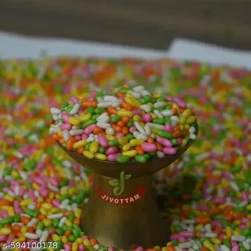 Desipan Jivottam colorful fennel seeds in a brass bowl, coated in candy shells. Sweet anise flavor.