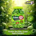 Desipan Cintu Green Apple Doubles candy jar, individually wrapped candies with green apple flavor, set outdoors with green apples in background.