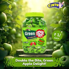 Desipan Cintu Green Apple Doubles candy jar, individually wrapped candies with green apple flavor, set outdoors with green apples in background.
