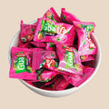 Desipan Centerfilled Candy Doubles, individually wrapped guava-flavored candies in vibrant pink packaging with green accents.