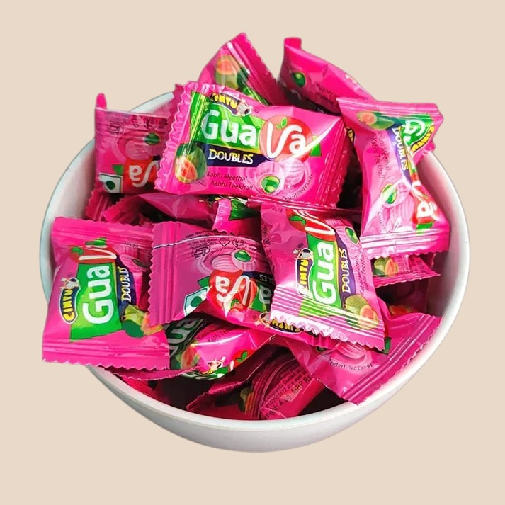 Desipan Centerfilled Candy Doubles, individually wrapped guava-flavored candies in vibrant pink packaging with green accents.