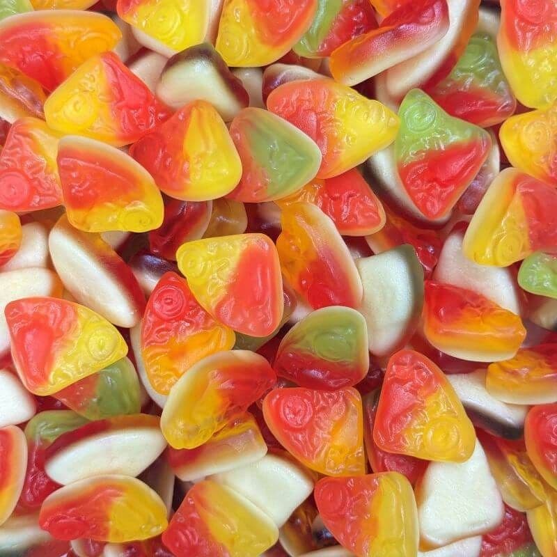 Desipan Fruity Gummy Candy Assortment in red, yellow, and green with playful fruit shapes and a glossy finish.