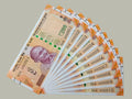 Desipan Indian 200 Rupee banknotes collection featuring Mahatma Gandhi portrait, orange and yellow hues, and serial numbers 000001-000010.