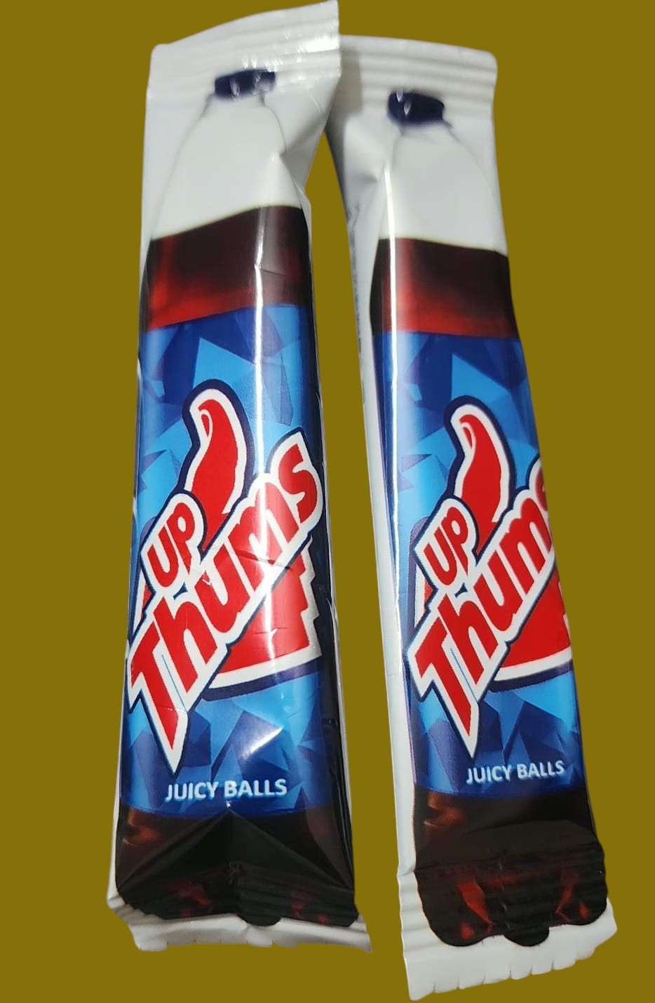 Desipan Up Thumbs Juicy Balls candy sticks with blue and red packaging and a thumbs up logo.