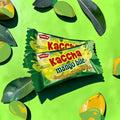 Desipan Parle Kaccha Mango Bite raw mango flavored candies, individually wrapped, with a sweet and sour taste.