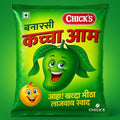 Desipan Chick's Banarsi Kachcha Aam snacks packaging with cartoon mango and orange characters, green and yellow.