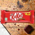 Desipan Nestle Kit Kat chocolate bar with crispy wafer fingers covered in milk chocolate. Features a ₹10 price tag.
