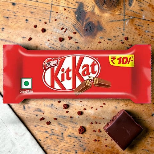 Desipan Nestle Kit Kat chocolate bar with crispy wafer fingers covered in milk chocolate. Features a ₹10 price tag.
