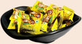 Desipan Mango Doubles chewy candies, individually wrapped in bright yellow packaging with mango graphics.