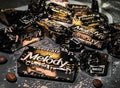 Desipan Melody Chocolaty Candy individually wrapped in black and gold foil with musical notes.
