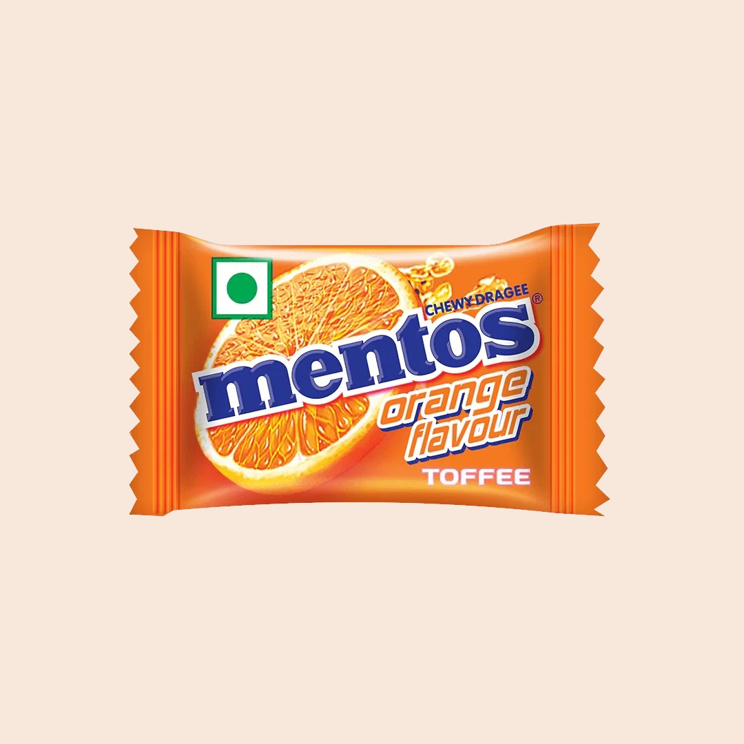 Desipan Mentos Orange Flavour Chewy Dragee Toffee candy with a half orange slice on the wrapper.