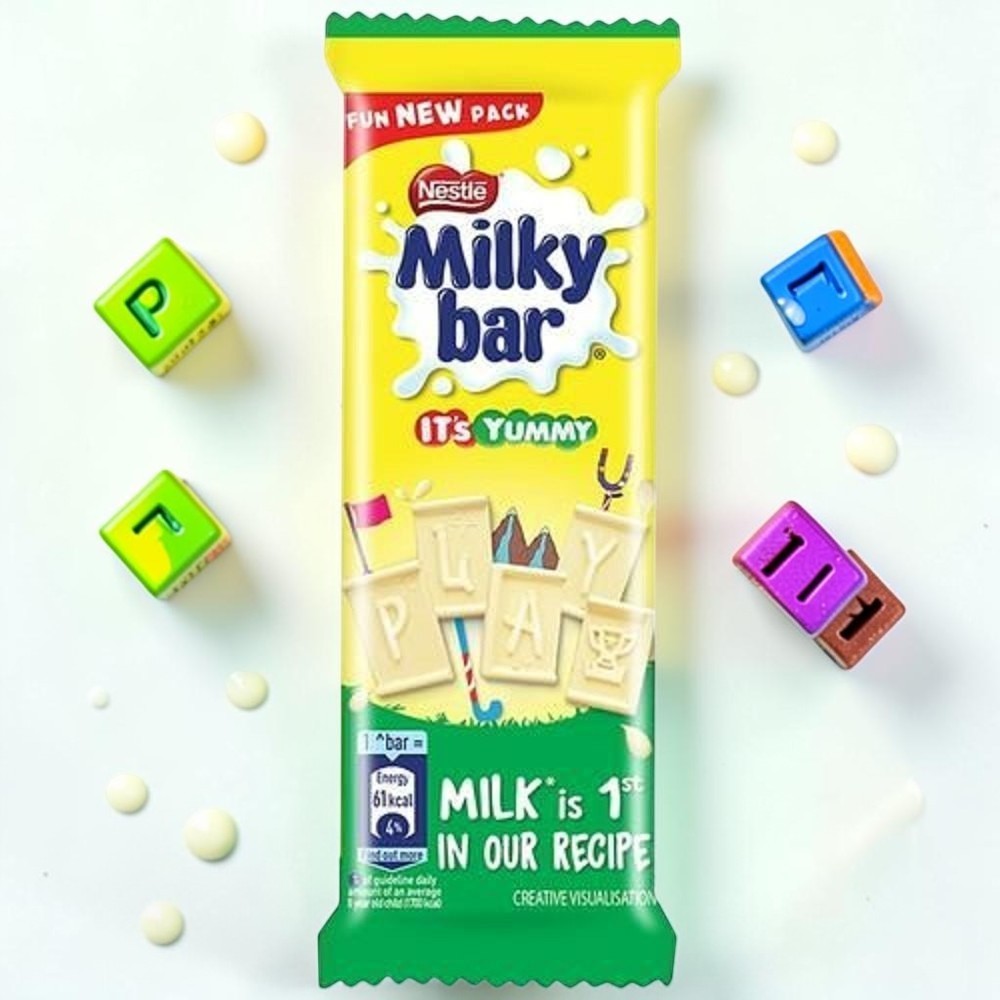 Desipan Milky Bar white chocolate bar with playful letter shapes spelling PLAY, fun new pack.