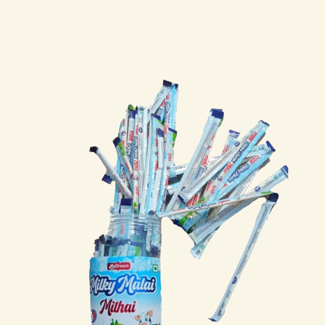 Desipan Milky Malai Mithai candy sticks in a jar, individually wrapped in light blue and white packaging.