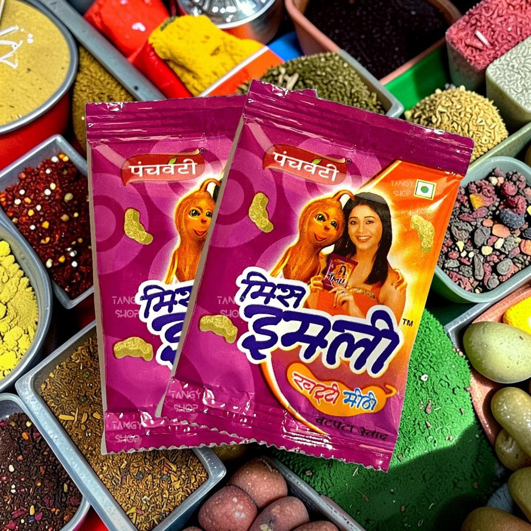 Desipan Panchvati Miss Imly tangy tamarind snacks in purple packaging with cartoon character and woman.