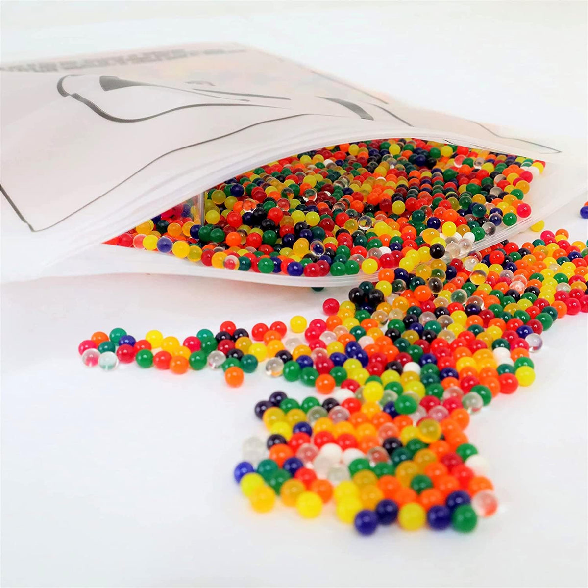 Desipan assorted multi-colored water absorbing gel beads spilling from a clear sensory play refill pack