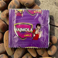 Desipan Najmola Imli candy wrapper with a cartoon man giving thumbs up. Purple wrapper with yellow and pink accents.