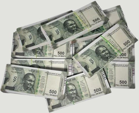 Desipan novelty Indian 500 Rupee banknotes in stacks, green and white with Mahatma Gandhi portrait.