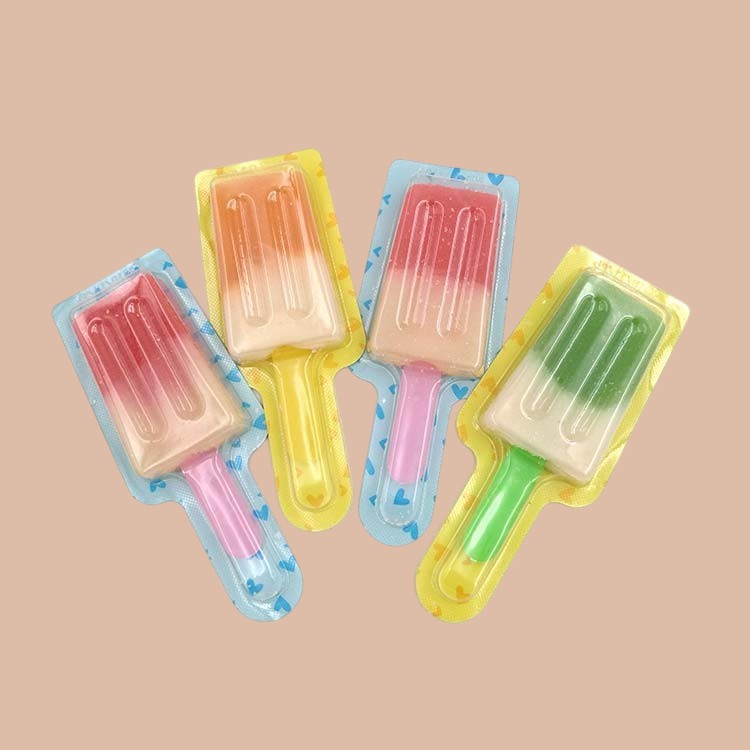 Desipan popsicle-shaped gummies in assorted fruit flavors and colors, individually wrapped.