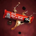 Desipan Rol-a-Cola The Solid Cola Candy bar with cola splash and coffee beans.