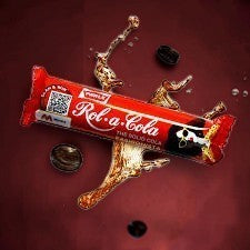 Desipan Rol-a-Cola The Solid Cola Candy bar with cola splash and coffee beans.