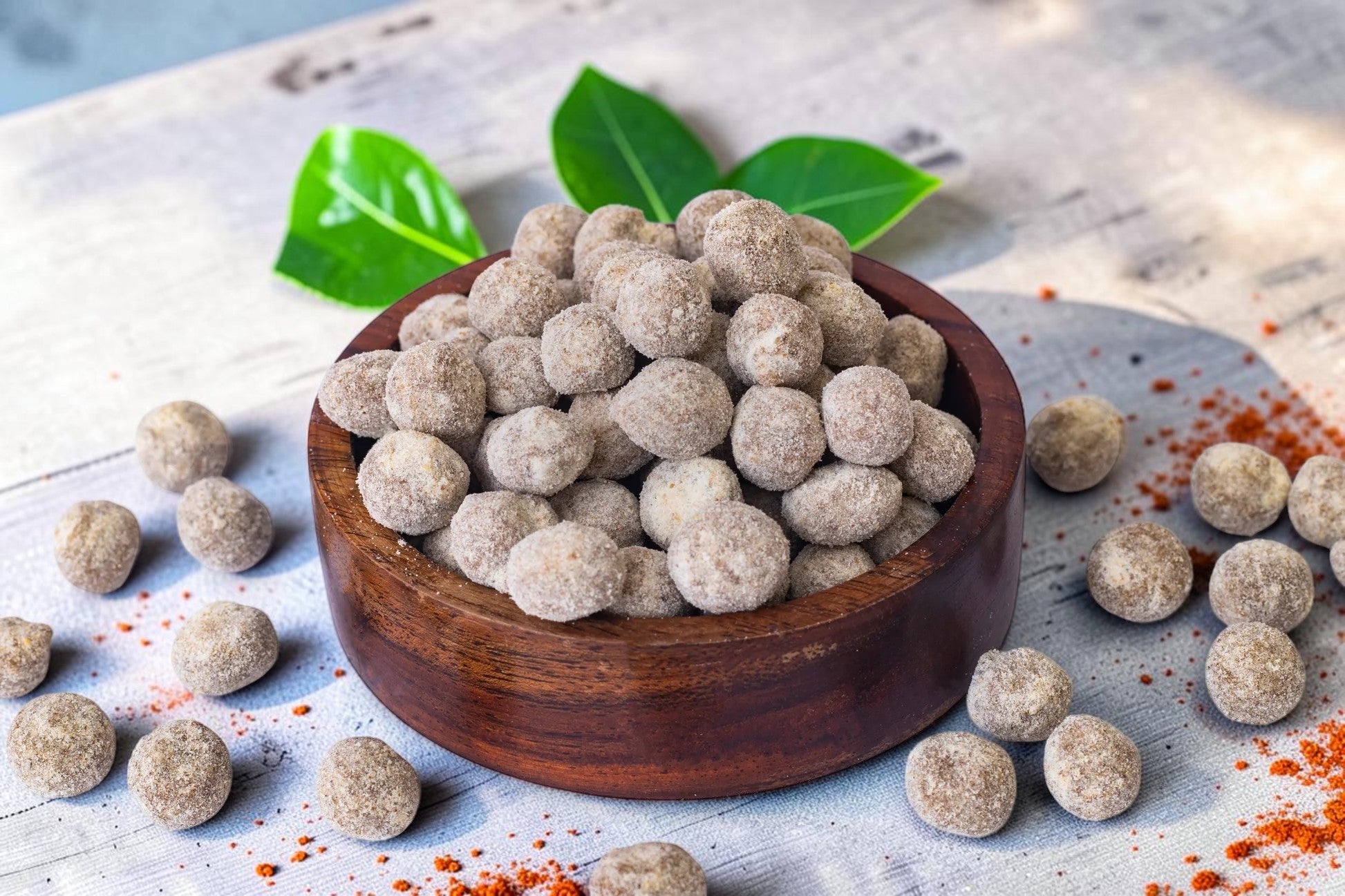 Desipan Sweetened Peanut Balls in a wooden bowl, a healthy and crunchy snack.