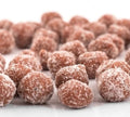 Desipan tamarind balls coated in sugar and spices, offering a sweet and tangy flavor.