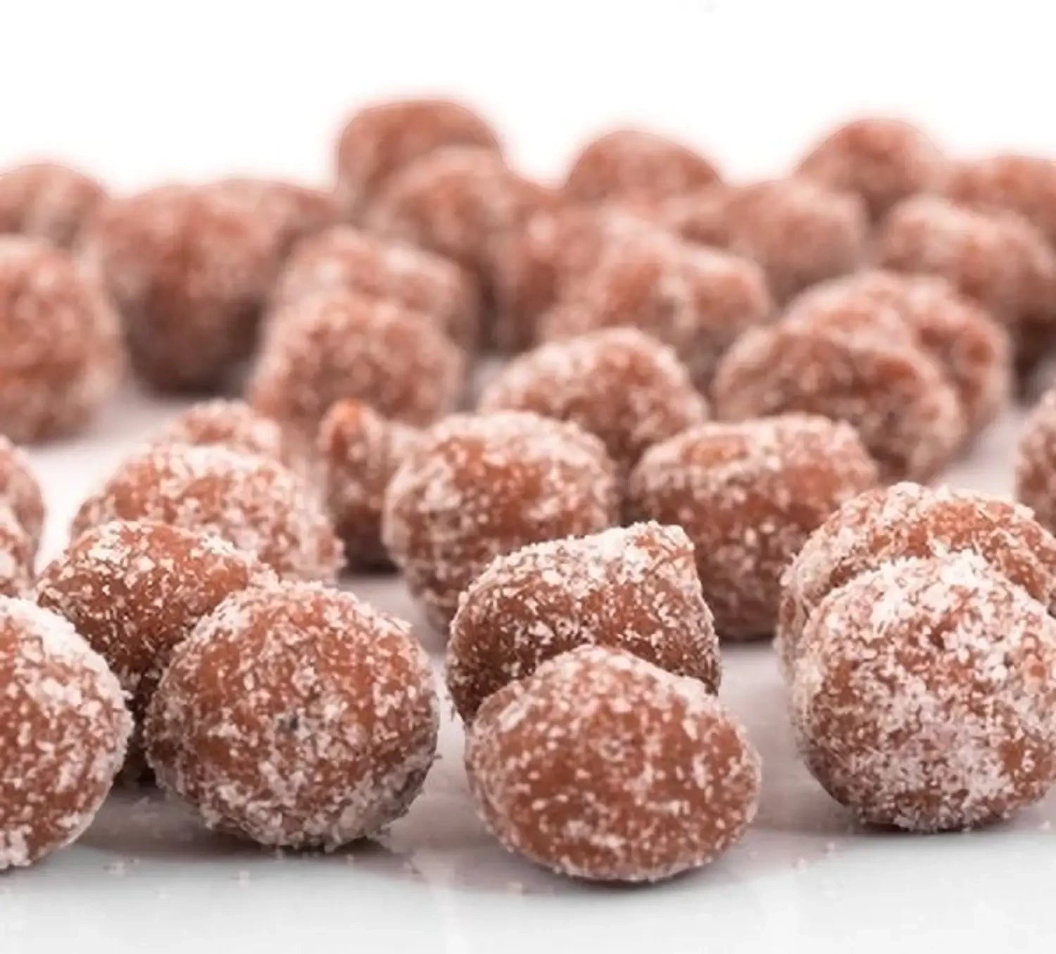 Desipan tamarind balls coated in sugar and spices, offering a sweet and tangy flavor.