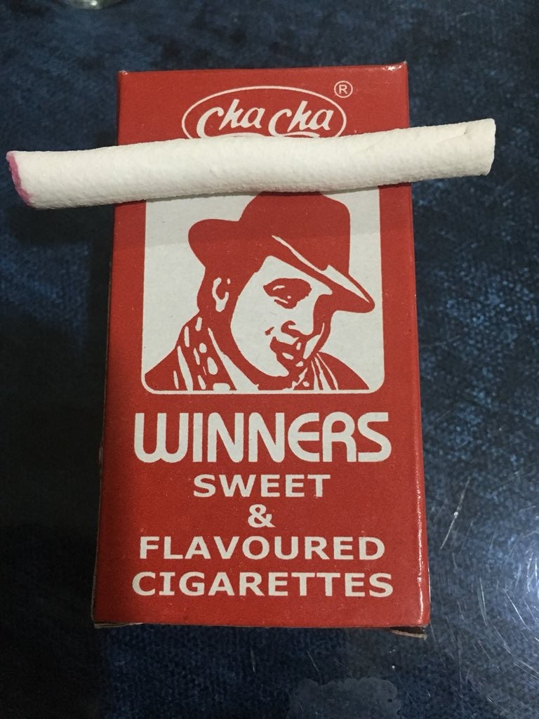 Desipan Winners Sweet & Flavoured Cigarettes pack with a single cigarette resting on top. Red packaging with white text and graphics.