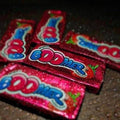 Desipan Wrigley's Boomer Bubble Gum in strawberry flavor, pink packaging with blue lettering and strawberry graphics.